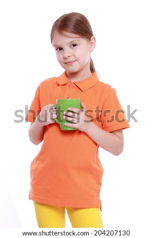 caucasian little girl holding green tea cup isolated over white background