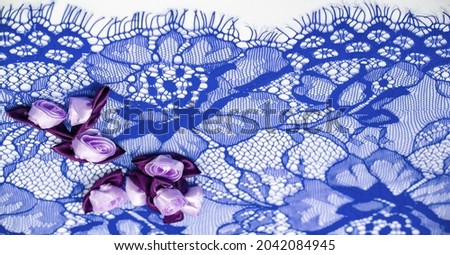 Blue lace with floral design. DIY crafts. Designer accessories. Decorations for your projects. Elastic finish. Texture background pattern