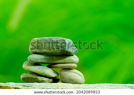 close - up stacked round stones with blured background