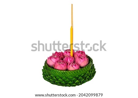 Banana leaf Krathong that have 3 incense sticks and candle decorates with pink lotus flowers for Thailand full moon or Loy Krathong festival isolated on white background.