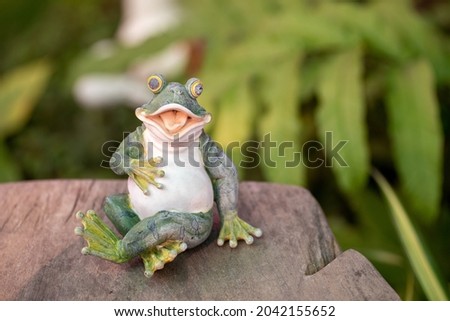 Frog statue for garden decorated