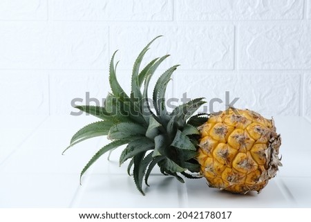 A ripe pineapple isolated on a white background. Selective focus image, copy space.