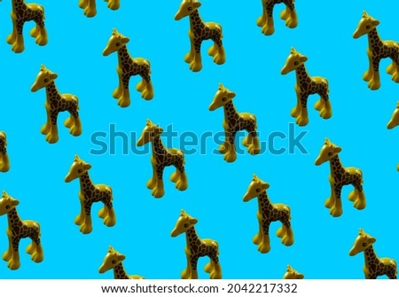 Background for the design and banner. A toy giraffe on a blue background. Pattern