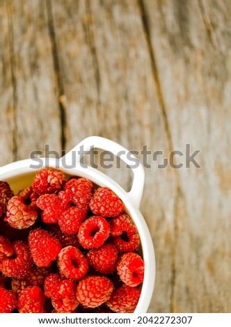 Raspberries background. Fresh red berries of ripe raspberries

