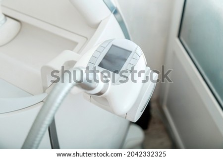 LPG machine massage for lifting body. Beauty Hardware machinery LPG massage equipment against cellulite. LPG hardware cosmetology device for beauty treatment body care procedures. Royalty-Free Stock Photo #2042332325