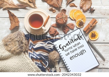 Autumn flay lay background and notebook with quotes - Gratitude turns what we have into enough