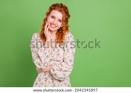 Photo of lovely curly hairdo young lady hand face wear blouse isolated on pastel green color background