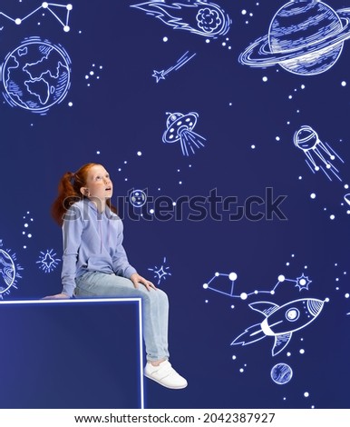 Exploring space. Creative artwork with little girl sitting on big box, dreaming looking at drawn planets, asteroids and stars in outer space. Ideas, inspiration, imagination. Collage, illustration