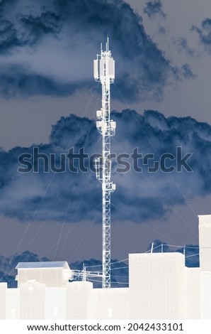 A 5G cellular networks on a tall building against a dramatic sky Royalty-Free Stock Photo #2042433101