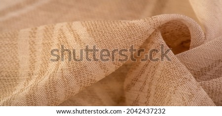 silk  cambric , cambric - very thin translucent soft mercerized fabric, beige. Texture, background, pattern, sensation