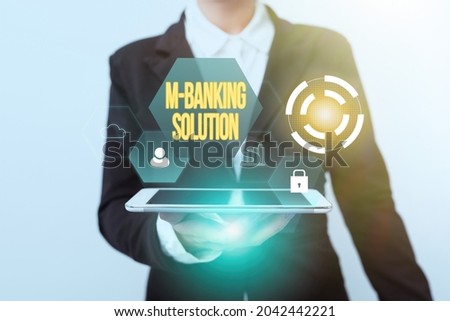 Conceptual display M Banking Solution. Business overview accessed banking through an application on the smartphone Woman In Suit Standing Using Device Showing New Futuristic Virtual Tech.
