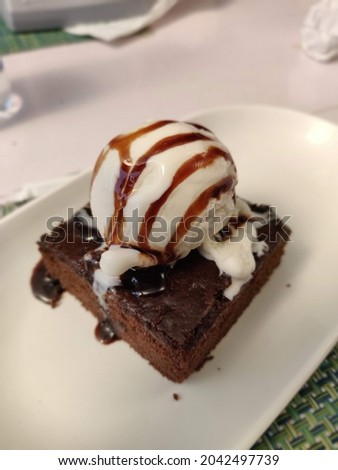 A very nice picture of a delicious dessert - chocolate brownie and vanilla icecream!