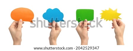 Group of multicolored speech bubbles in hands, empty cardboard and paper mockup banner, giving feedback concept, isolated on a white background 