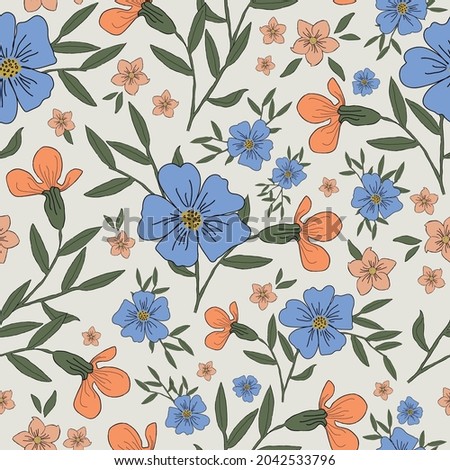 Seamless vintage pattern . wonderful orange and light blue flowers . green leaves. on a white background. vector texture. trend print for textiles and wallpaper.