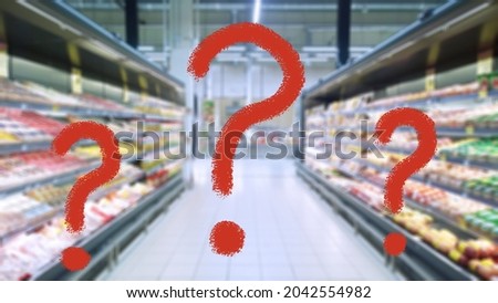 Three large red question mark on abstract blur image of supermarket background. Defocused shelves with products. Grocery shopping. Store. Retail industry. Food. Rack. Inflation and problem concept.
