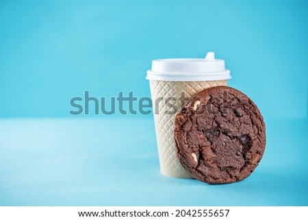 Chocolate cookies with dark and white chocoltae slices on a blue background. toning. selective Focus