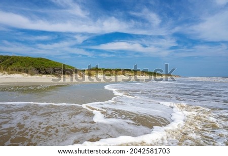 Beautiful Jekyll Island beach. Landscape of dunes, beach and ocean  One of the  Golden Isles barrier islands off of Georgia, USA. Royalty-Free Stock Photo #2042581703
