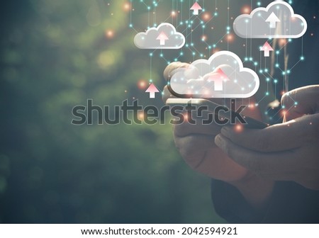 Hand man using mobile phone for doing cloud uploading data on the Internet online.network,media,keyword,Digital Web,Photo concept information and Technology.
