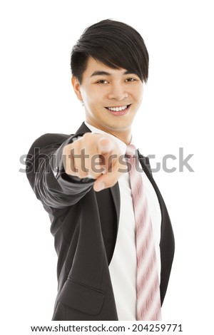 smiling young business man point finger to camera lens