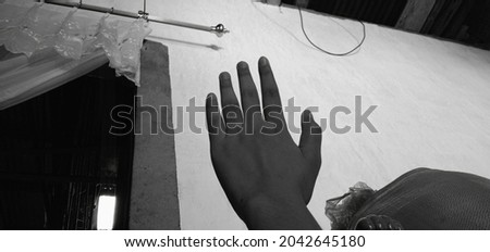 black and white photo in which there are hands and other objects 