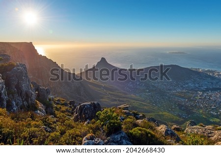 Cape Town skyline and Lion's Head peak at sunset seen from Table Mountain national park, Cape Town, South Africa.