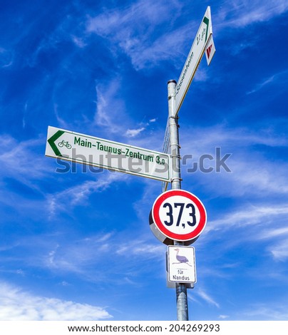 street sign for nandus under blue sky in Germany