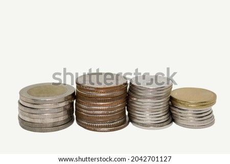 Thai coins stacked on each other in different positions.on a white background