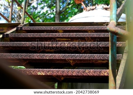 rusty iron ladder in old factory