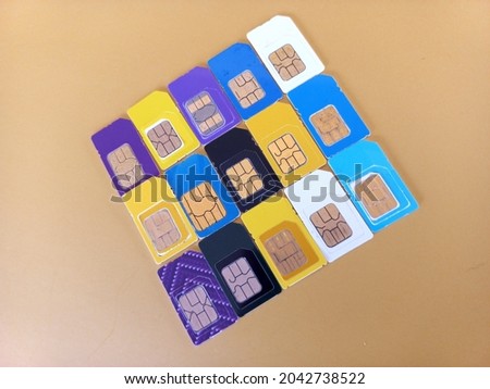 variety sim cards on yellow background