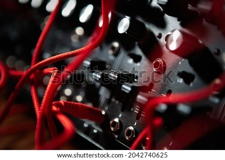 Modular synthesizer device. Analog synth for electronic music production in sound recording studio. Compose new musical tracks with professional audio equipment  Royalty-Free Stock Photo #2042740625