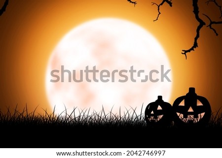 Silhouette of Jack-o-Lantern on the grass with full moon background