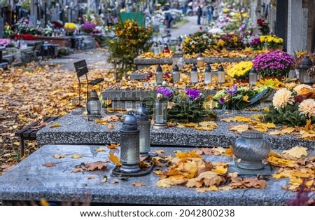 Decorated graves on Wolski Cemetery just before All Saints Day in Warsaw, capital of Poland Royalty-Free Stock Photo #2042800238