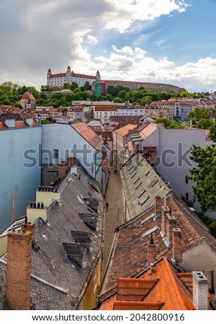 A picture of the rooftops leading up to the Bratislava Castle.