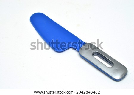 Blue plastic toy knive isolated on a white background