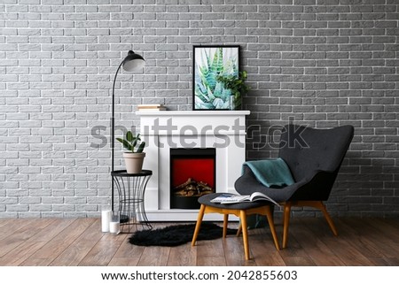 Modern fireplace in interior of stylish living room