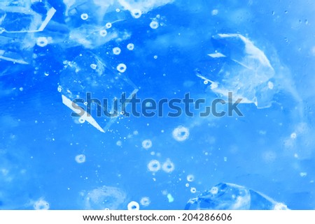 Abstract composition with sugar cubes in a jar with sweetness (inverted colors). It looks like water with bubbles and ice cubes 