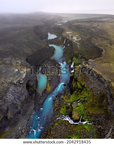 panorama of waterfalls at a blue glacial river in the icelandic highlands