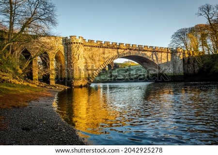The lower bridge pool on the River Dee at Telford Bridge in Tongland, at high tide, Kirkcudbright Scotland Royalty-Free Stock Photo #2042925278