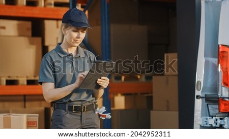 Portrait of Beautiful White Woman Worker  Using Tablet Computer To Check Inventory. Happy Professional Working in Logistics Retail Center, Delivering e-Commerce Online Orders, Food, Frontline Heroes Royalty-Free Stock Photo #2042952311