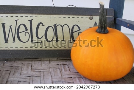 Fall festive welcome sign with pumpkin