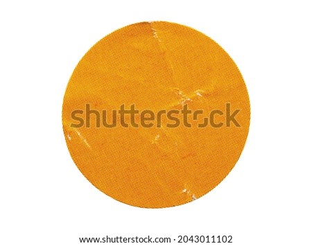 Blank orange round adhesive paper sticker label isolated on white background