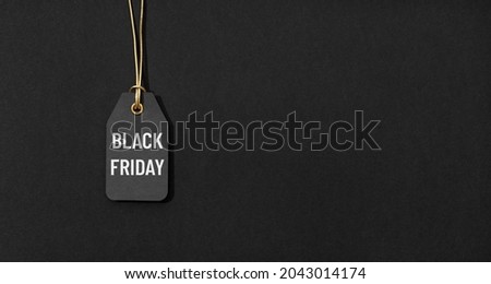 Black friday tag isolated on black background with copy space Royalty-Free Stock Photo #2043014174