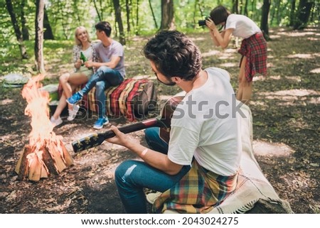 Photo of four friends guy play acoustic guitar couple enjoy beer lady make photo wear casual outfit nature woods outdoors