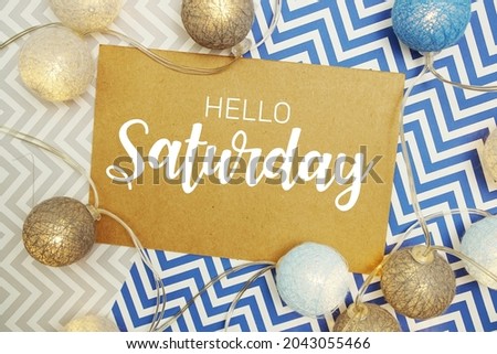 Hello Saturday typography text on paper card with LED cotton balls decoration