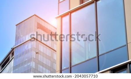 Glass office building in city center on a background close up. Urban architecture of building business district.