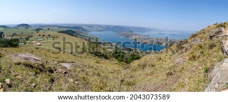 Panoramic view of the Chavantes dam and Hawk Hill in the municipality of Ribeirão Claro, Parana, Brazil, 2021. Royalty-Free Stock Photo #2043073589