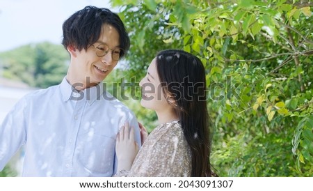 Asian young couple with a smile
