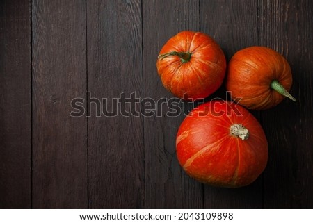 Group of pumpkins on wooden table with copy space. Flat lay. High quality photo