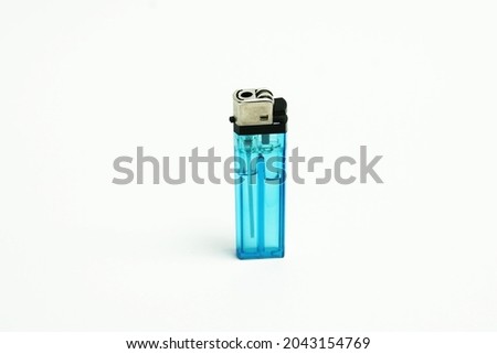Plastic lighter with liquid gas, isolated on white background.                                