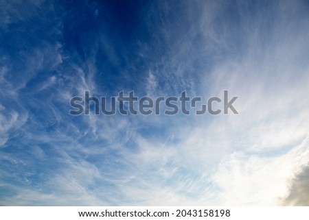 white fluffy clouds natural abstract background. Blue sky.